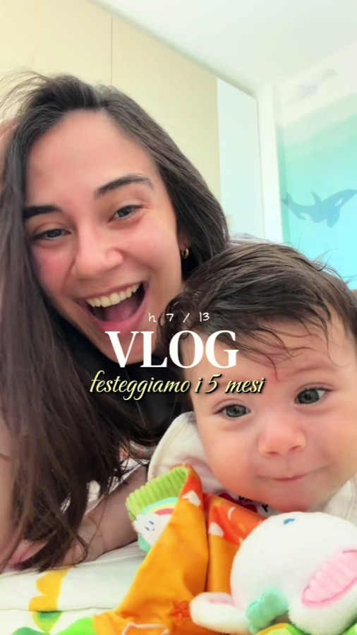 Claudia smiling with her baby in her video